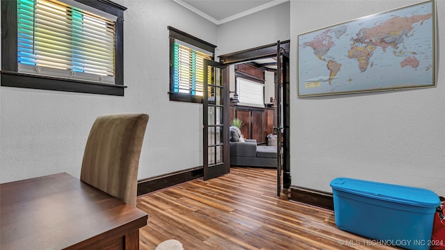 office space featuring wood-type flooring and ornamental molding