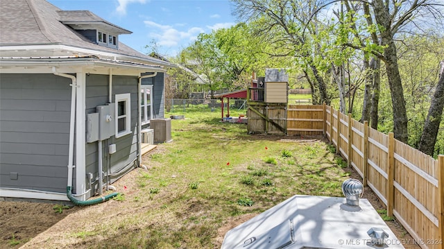 view of yard featuring central AC