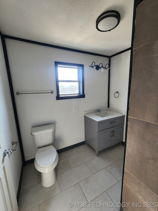 400 Tulsa Ave, Spavinaw, OK 74366 - bathroom featuring vanity, tile patterned floors, toilet, and baseboards