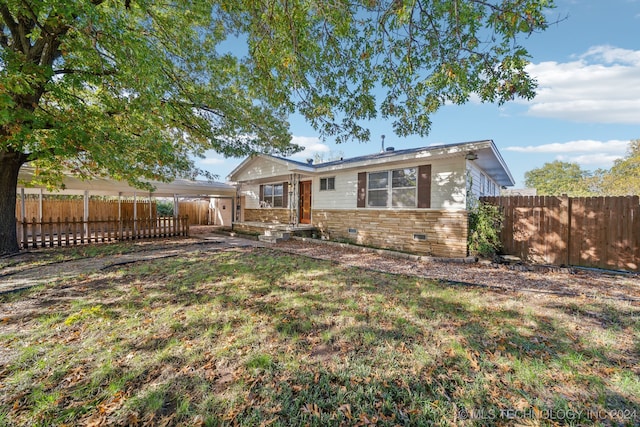 ranch-style home with a front lawn