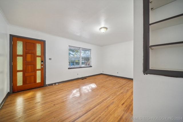 spare room featuring light wood-type flooring