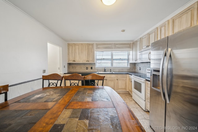 kitchen featuring sink, white appliances, tasteful backsplash, ornamental molding, and light brown cabinets