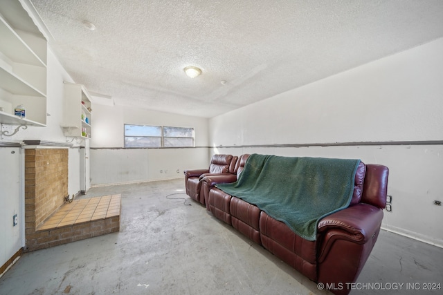 living room with concrete flooring and a textured ceiling