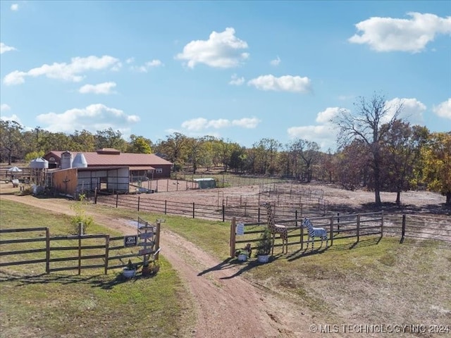 view of yard with a rural view