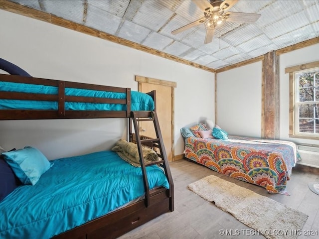 bedroom featuring hardwood / wood-style flooring and ceiling fan