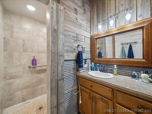 bathroom featuring vanity and a tile shower