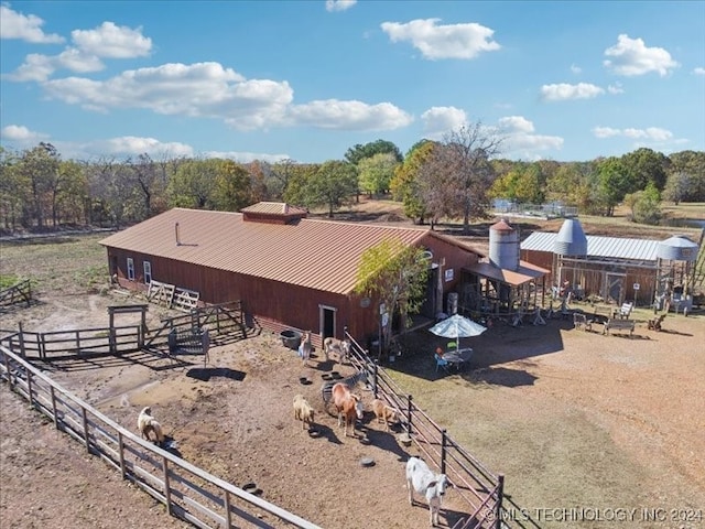 birds eye view of property with a rural view