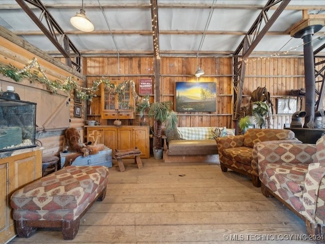 sunroom featuring a wood stove