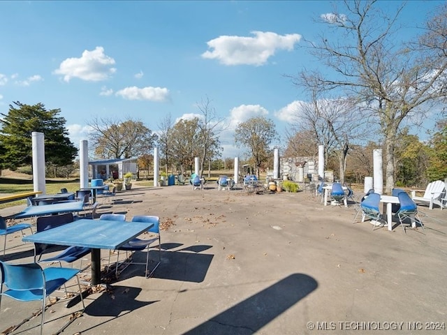 view of home's community with a patio area