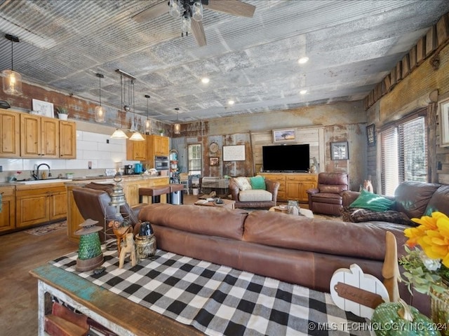 living room with sink and ceiling fan