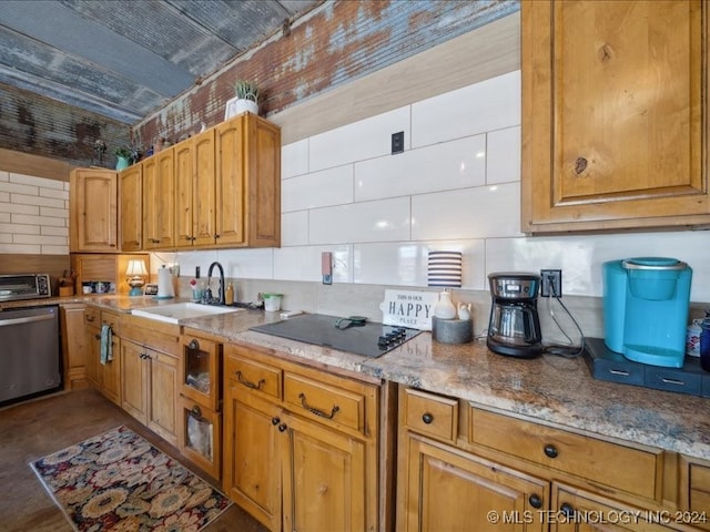 kitchen featuring light stone counters, black electric stovetop, backsplash, sink, and dishwasher