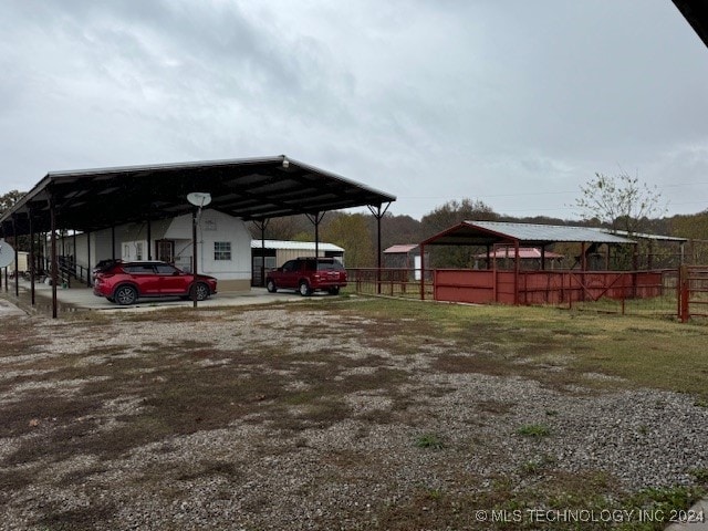 view of parking / parking lot with a carport