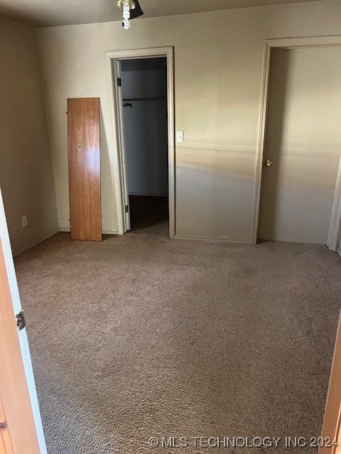 unfurnished bedroom featuring carpet floors