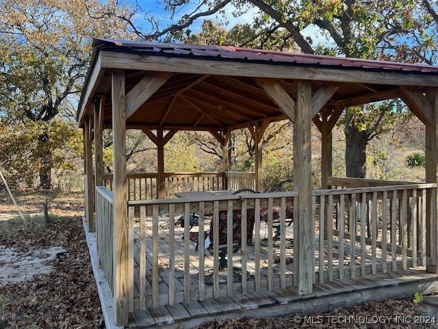 view of community with a gazebo and a wooden deck