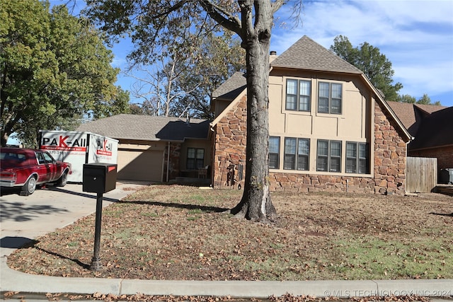 view of front of property featuring a garage