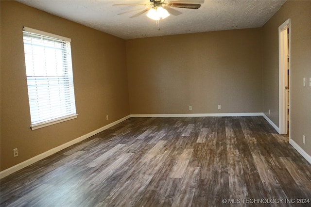 unfurnished room with a textured ceiling, dark hardwood / wood-style flooring, and ceiling fan