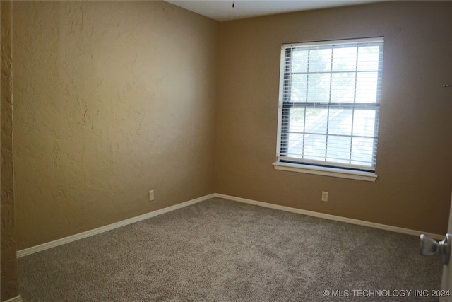 empty room with carpet flooring