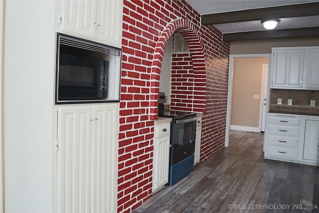 kitchen with white cabinetry, brick wall, black appliances, beam ceiling, and dark hardwood / wood-style flooring