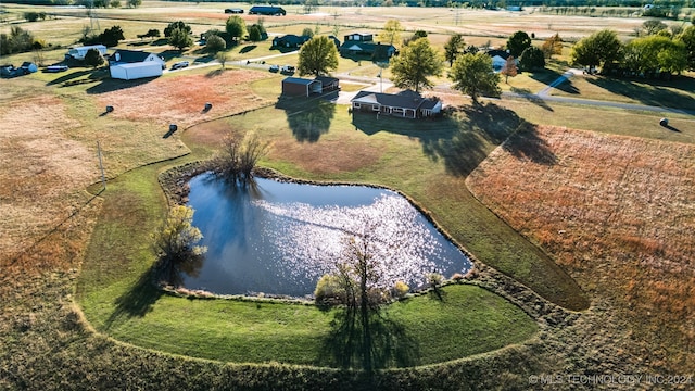 drone / aerial view with a water view and a rural view