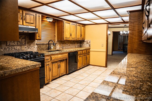 kitchen featuring black appliances, tasteful backsplash, sink, and light tile patterned floors