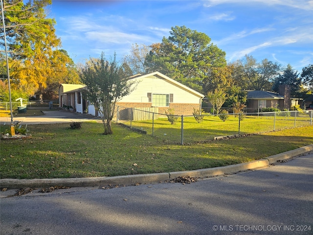 ranch-style home with a front lawn