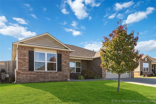 view of front facade with a garage and a front lawn