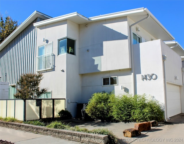 view of property exterior with a garage