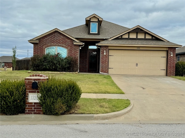 view of front facade with a garage and a front yard