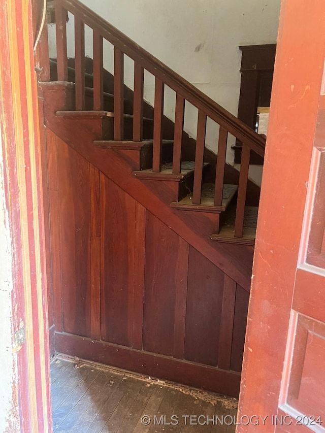 staircase featuring hardwood / wood-style flooring