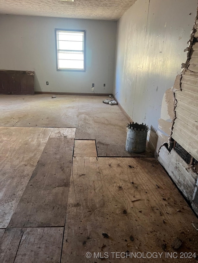 spare room featuring a textured ceiling