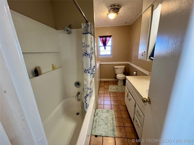 full bathroom featuring toilet, tile patterned flooring, a textured ceiling, vanity, and shower / bathtub combination with curtain