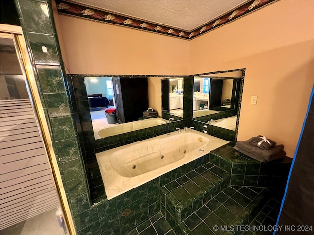 bathroom with independent shower and bath, a textured ceiling, and tile patterned floors