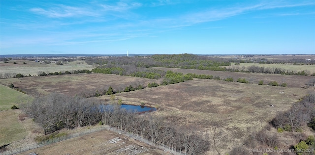 birds eye view of property featuring a rural view and a water view