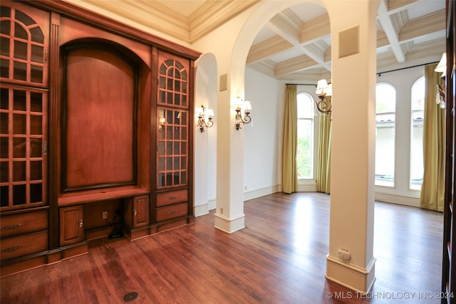 wine cellar featuring beam ceiling, dark hardwood / wood-style flooring, crown molding, and coffered ceiling