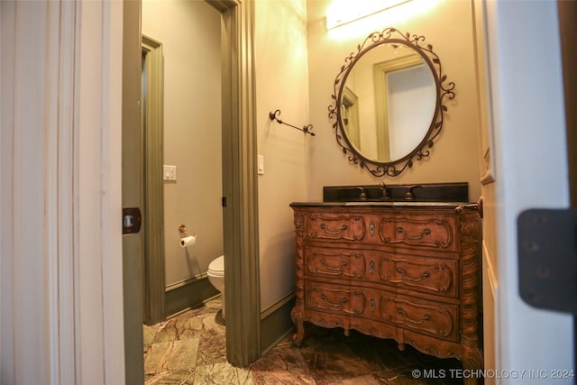 8403 S Allegheny Ave, Tulsa, OK 74137 - half bath featuring toilet, vanity, and marble look tiles
