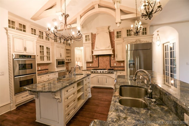 8403 S Allegheny Ave, Tulsa, OK 74137 - kitchen with a sink, custom exhaust hood, stainless steel appliances, a chandelier, and vaulted ceiling