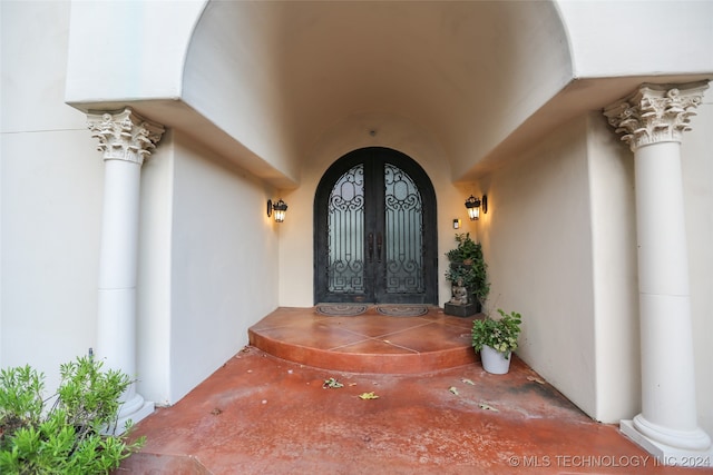 doorway to property featuring french doors