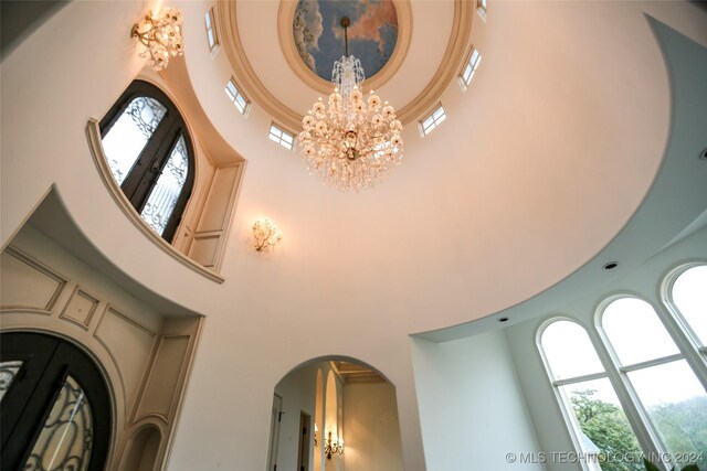 8403 S Allegheny Ave, Tulsa, OK 74137 - detailed view of a chandelier and arched walkways