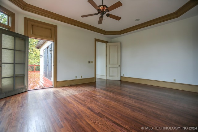 8403 S Allegheny Ave, Tulsa, OK 74137 - unfurnished room with ornamental molding, dark wood-style floors, a ceiling fan, baseboards, and a raised ceiling
