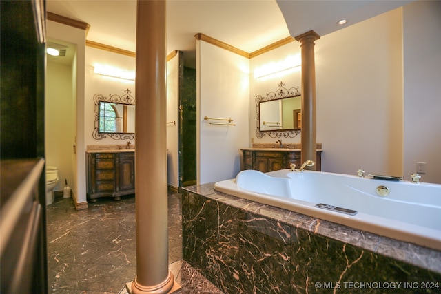 bathroom with vanity, ornamental molding, tiled tub, and decorative columns