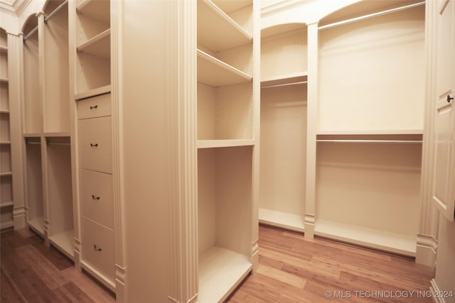 8403 S Allegheny Ave, Tulsa, OK 74137 - walk in closet featuring wood finished floors