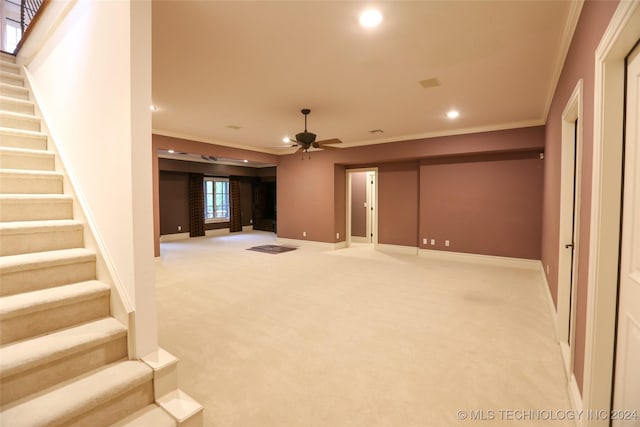 8403 S Allegheny Ave, Tulsa, OK 74137 - unfurnished living room with light colored carpet, crown molding, stairs, recessed lighting, and baseboards