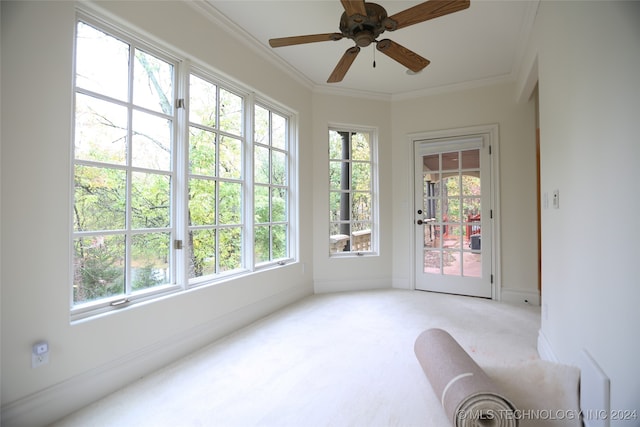 sunroom / solarium featuring ceiling fan