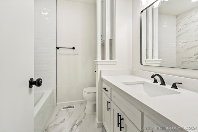 full bathroom with vanity, tiled shower / bath, and toilet