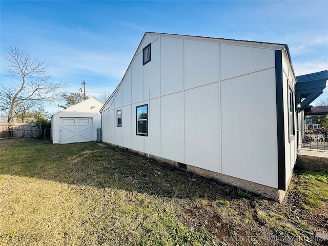 view of side of home featuring a shed and a yard