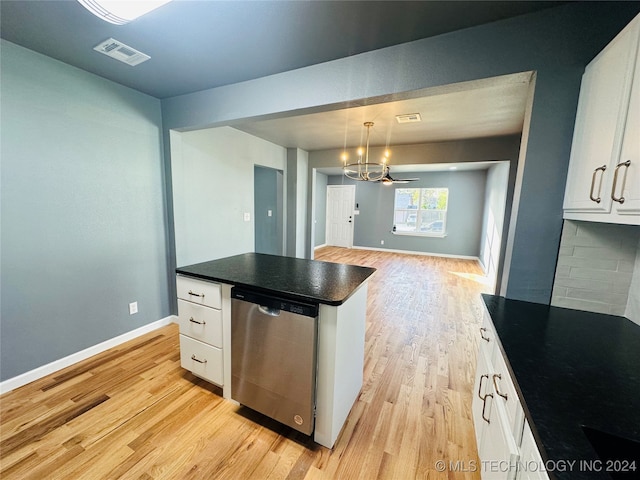 kitchen featuring white cabinets, backsplash, decorative light fixtures, and dishwasher