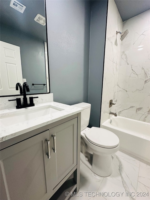 full bathroom featuring vanity, toilet, and tiled shower / bath