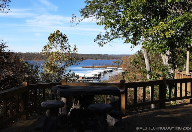 wooden deck with a water view