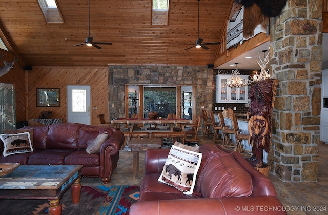 living room featuring high vaulted ceiling, wood walls, a skylight, and wooden ceiling