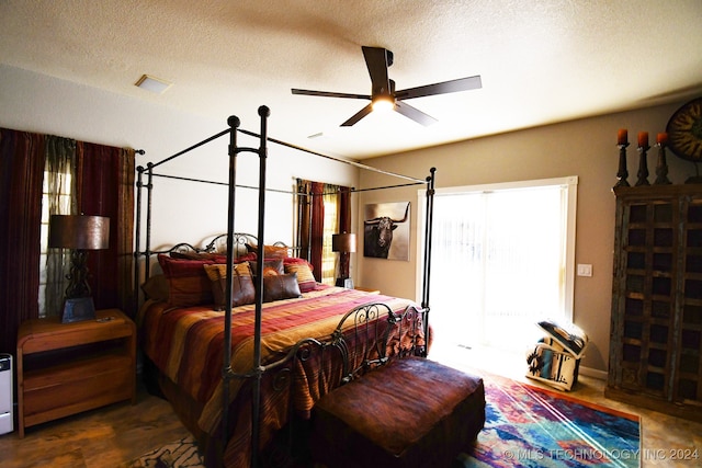 bedroom featuring a textured ceiling and ceiling fan